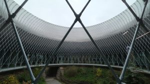 a circular building with a walkway going through it