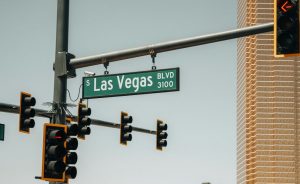 a traffic light with a street sign above it