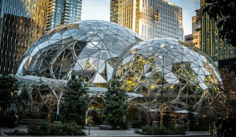 a couple of large glass domes sitting in the middle of a street