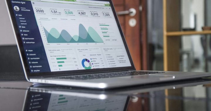 laptop computer on glass-top table