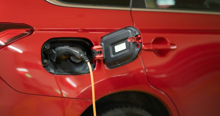 red car with yellow hose