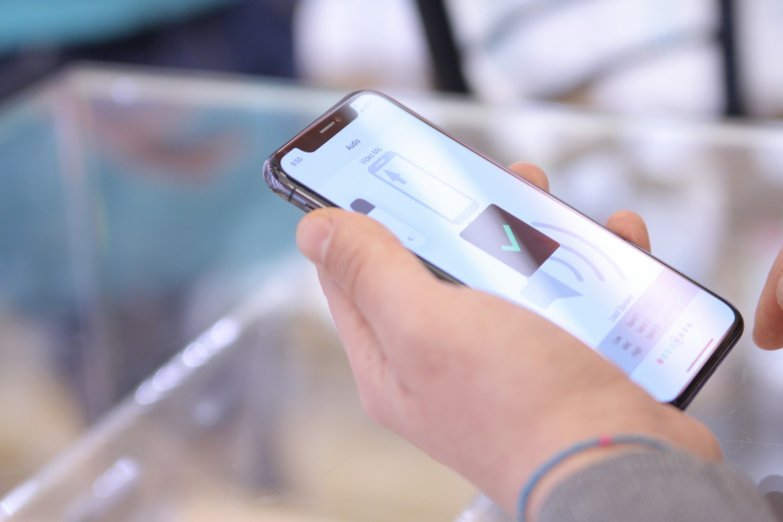 Photo by NSYS Group a person holding a smart phone in their hand