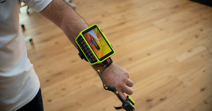 Person wearing a wearable device on arm