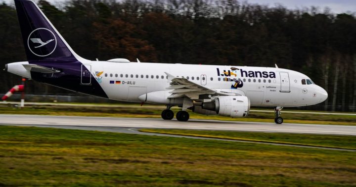 a large jetliner sitting on top of an airport runway