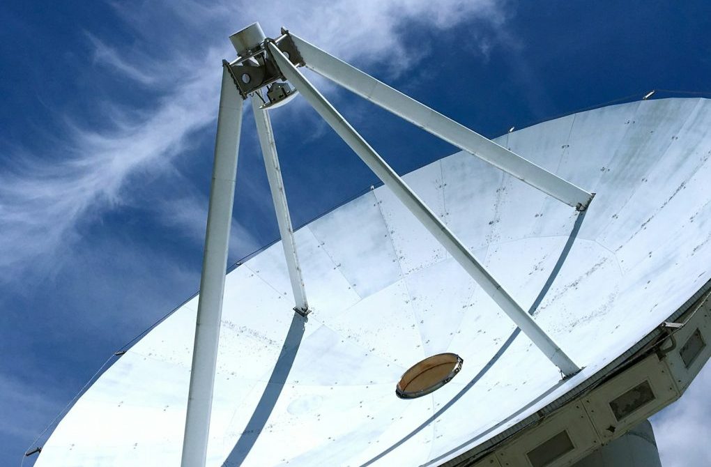 a white structure with a blue sky