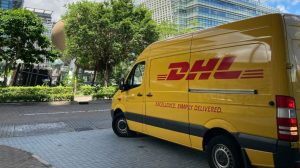 yellow van parked on sidewalk during daytime