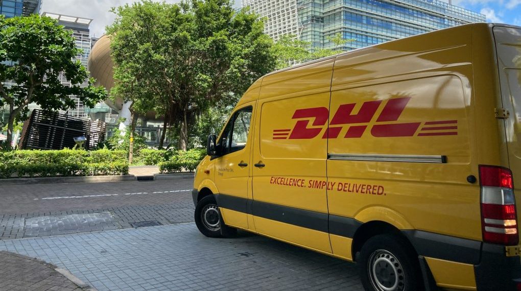 yellow van parked on sidewalk during daytime