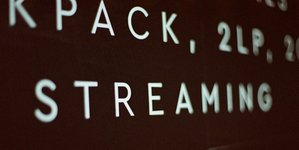 a close up of a street sign on a wall