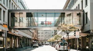 UBS logo on glass bridge wall during daytime