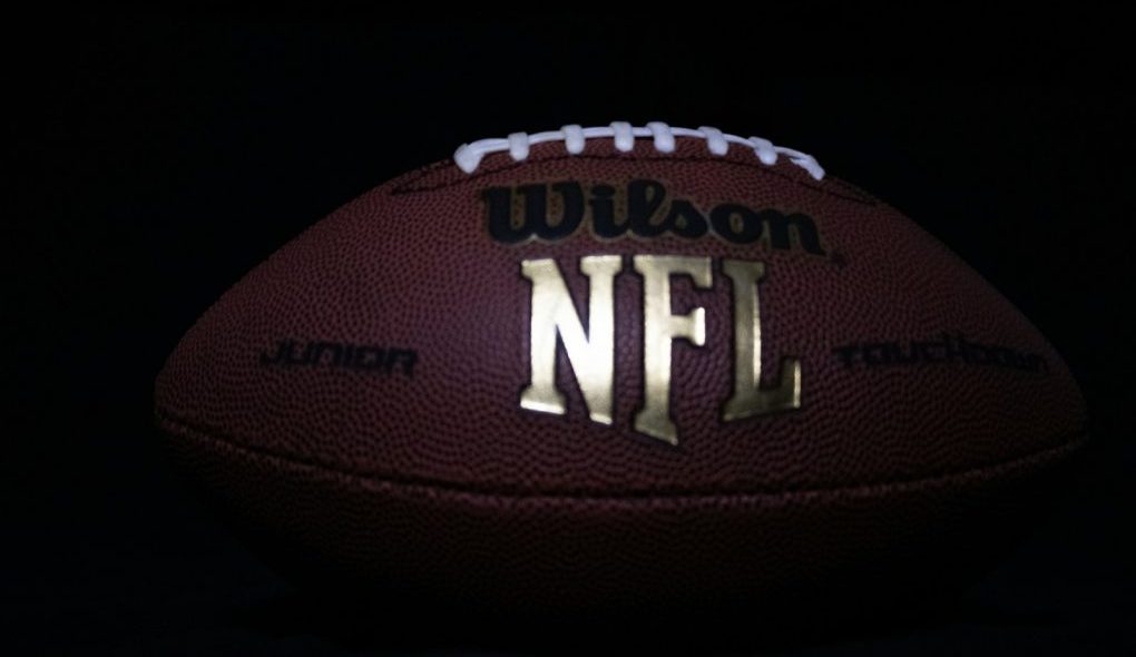 a close up of a football on a black background