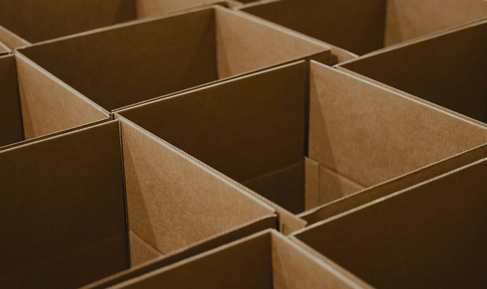 a lot of brown boxes that are open