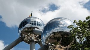a large metal structure with mirrored balls on top of it