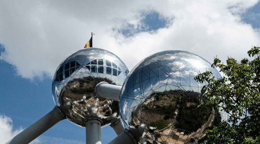 Photo by Janek Valdsalu a large metal structure with mirrored balls on top of it