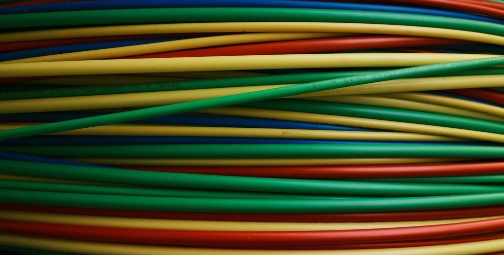 Colorful wires are bundled together, side by side